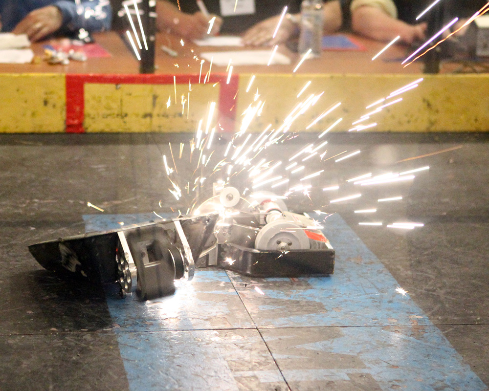 Robots grinding creating sparks